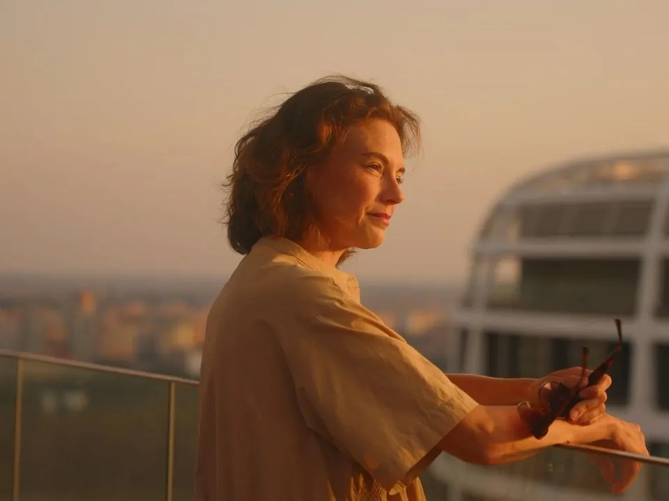 Woman at sunset on a Skypark balcony